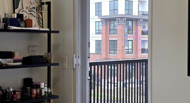 Retractable screen door installed in Langley apartment balcony at Latimer Heights