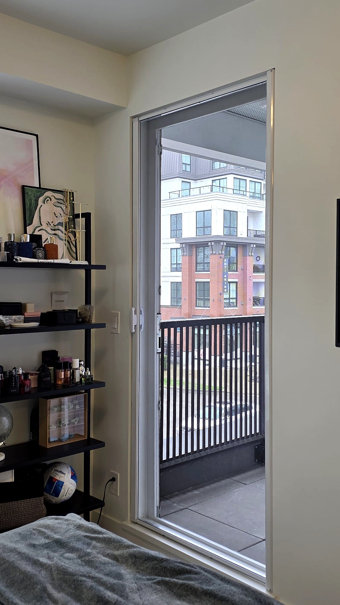 Retractable screen door installed in Langley apartment balcony at Latimer Heights